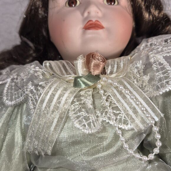 Heirloom Treasure Doll, Dark Long Curley Hair with Green Dress and Bow on Front - Picture 9 of 10